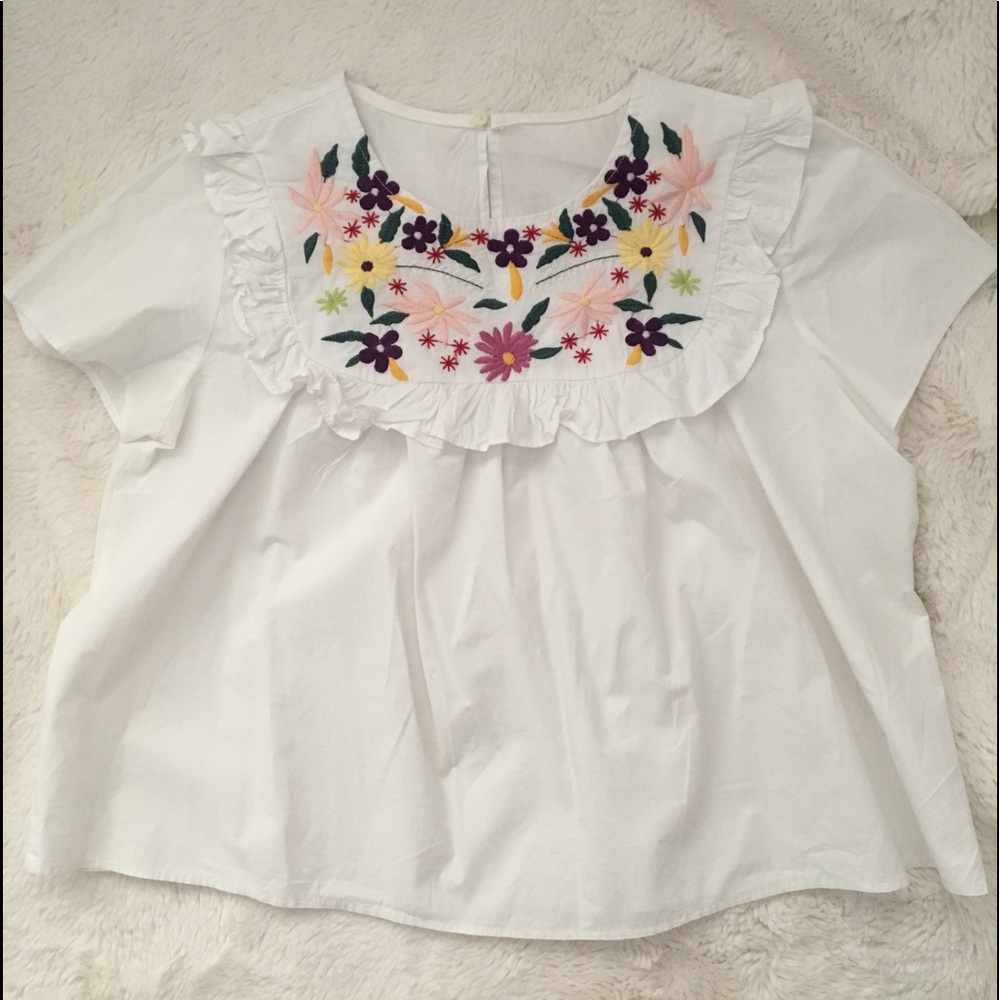White peplum embroidered neck